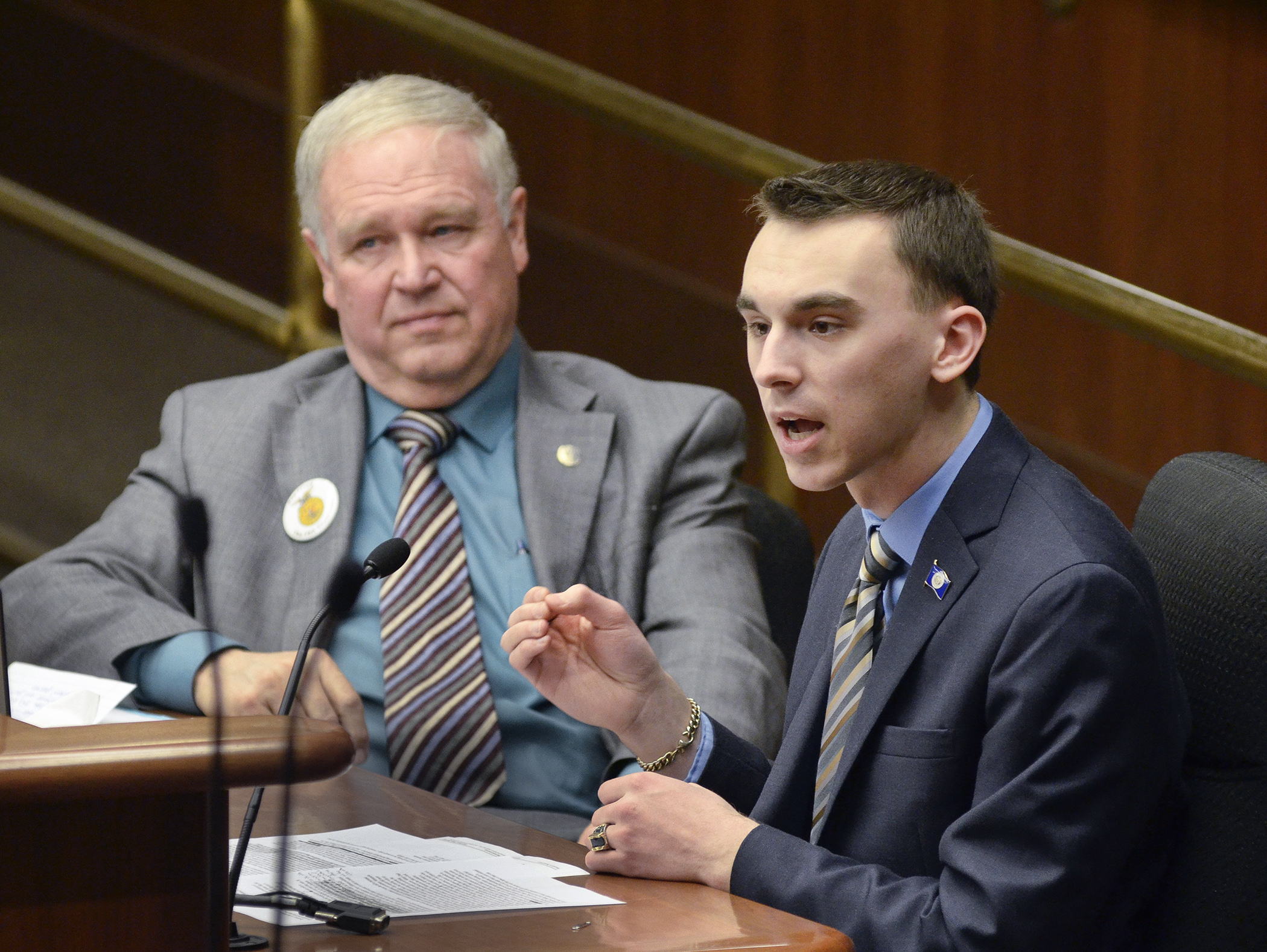 Dan Thomas-Cummins, an 18-year-old Lawrence University freshman, testifies before the House Government Operations and Elections Policy Committee Feb. 26 in support of a bill sponsored by Rep. Dean Urdahl, left, that would permit 17 year olds to register to vote. Photo by Andrew VonBank